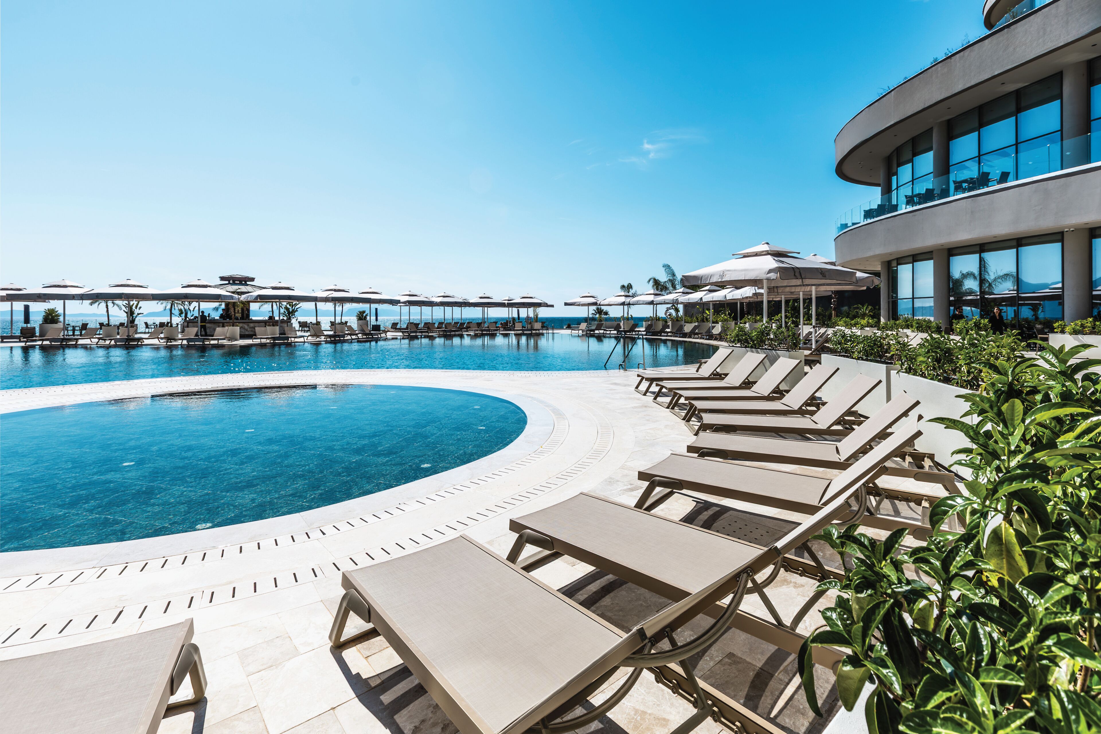 Indoor pool, 2 outdoor pools, open 8:00 AM to 7:00 PM, pool umbrellas