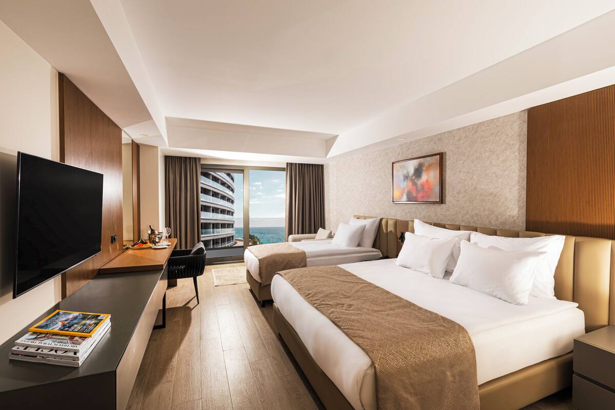 Deluxe Double Room, Balcony, Partial Sea View | Premium bedding, minibar (free items), in-room safe, blackout drapes