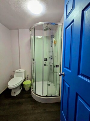 Economy Studio Suite | Bathroom | Shower, hair dryer, towels, soap