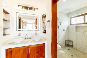 A modern bathroom with two vessel sinks, a large mirror, and a glass-enclosed shower. - Bougainvillea House&Mistico Beach Club+Boat Shuttle (San Pedro)