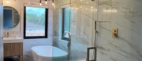Shower, hair dryer, towels, toilet paper