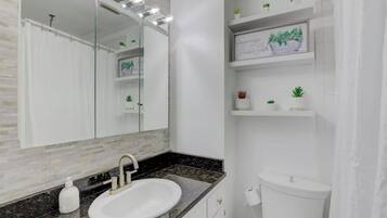 Jetted bath, hair dryer, towels, soap