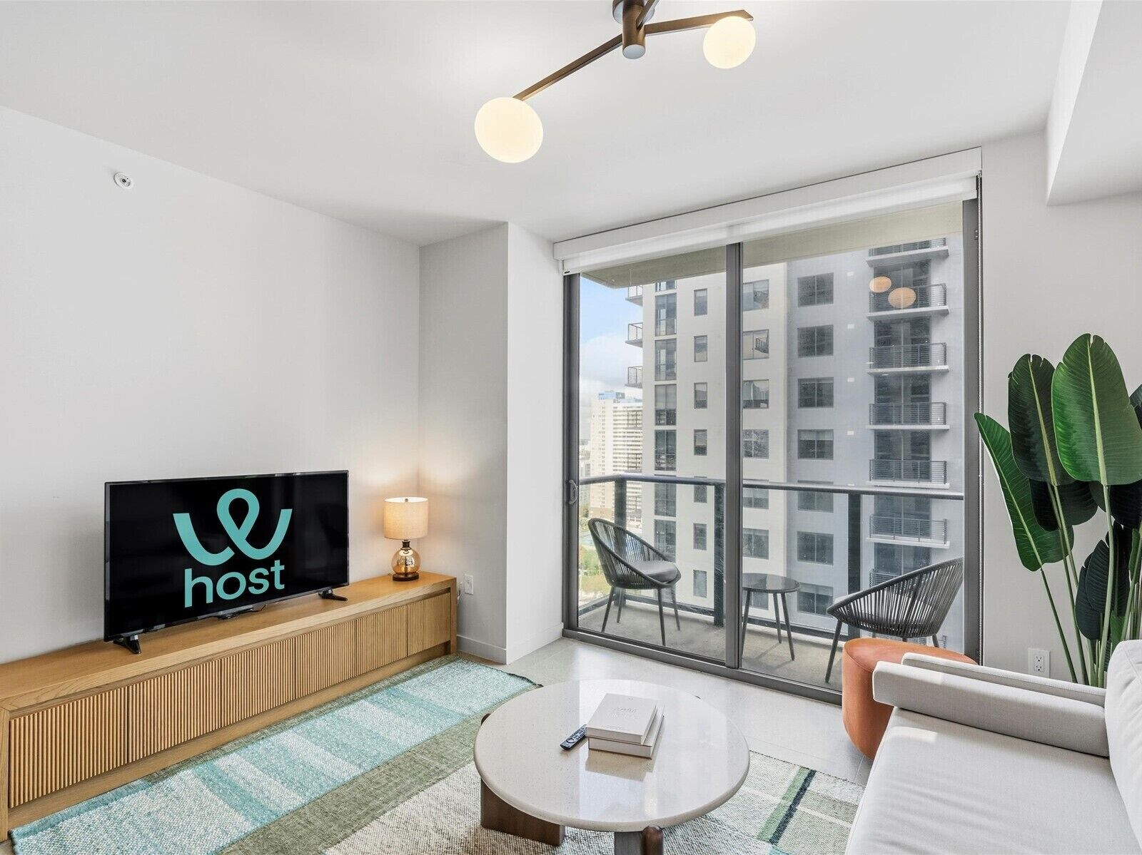 Comfort Apartment | Living area | 50-inch Smart TV with satellite channels