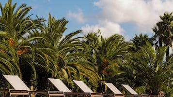 Seasonal outdoor pool, pool umbrellas, pool loungers