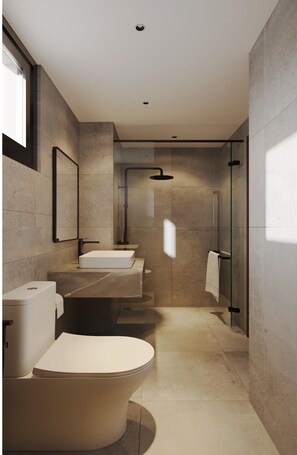 A modern bathroom with a freestanding bathtub, a glass-enclosed shower, and a large mirror. - 
Monthly Serviced Apartments 50m from My Khe Beach (Đà Nẵng)