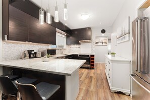 Fridge, microwave, stovetop, coffee/tea maker