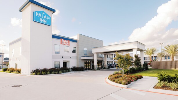 A hotel with a sign indicating 'NOW OPEN' and a 'PALACE INN' sign. - Palace Inn Blue 290 W 43rd & Bingle Rd (Houston)