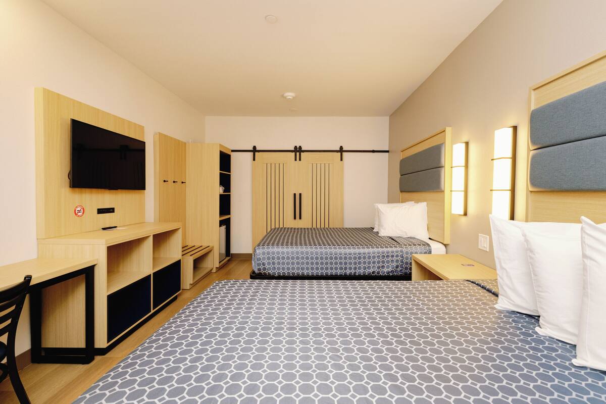 Memory foam beds, desk, laptop workspace, blackout drapes