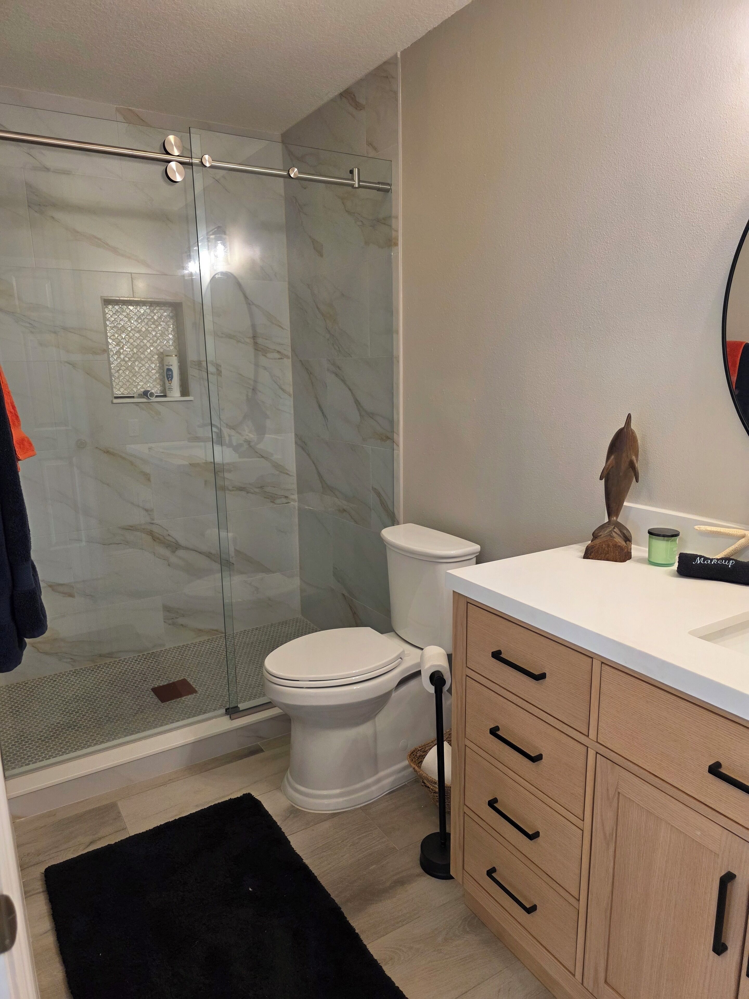 Shower, hair dryer, towels, toilet paper