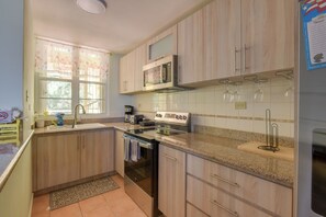 Fridge, microwave, stovetop, coffee/tea maker