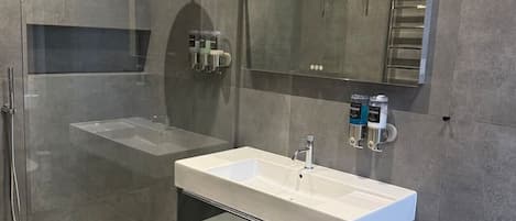 Shower, hair dryer, towels, soap