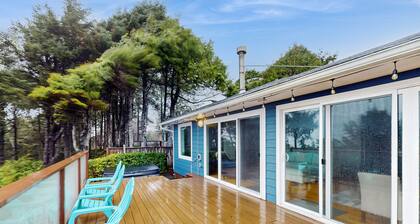Modern ocean view home with private hot tub, big deck, and family-ready spaces