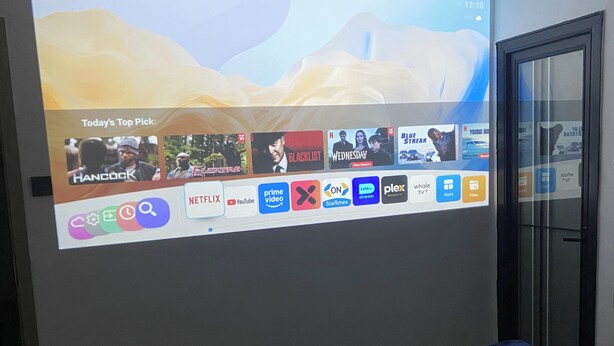 A hotel room with a large screen displaying a streaming service interface. - Lovely 2-bedroom in Nairobi near Yaya Centre — Everything Walkable (Nairobi)