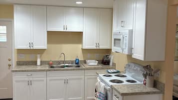 Fridge, microwave, stovetop, coffee/tea maker