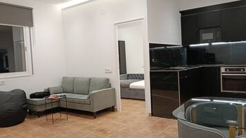 Comfort Apartment, Garden View | Living area