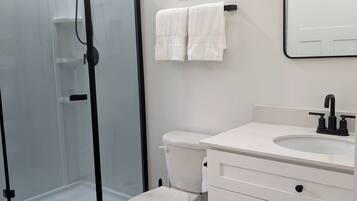 Shower, eco-friendly toiletries, hair dryer, towels