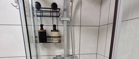 Shower, hair dryer, towels, soap