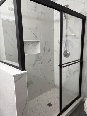 Shower, towels, soap, toilet paper