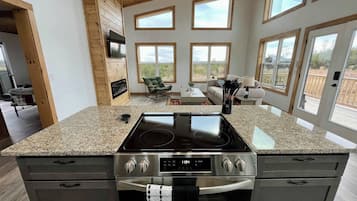 Fridge, stovetop, dishwasher, coffee/tea maker