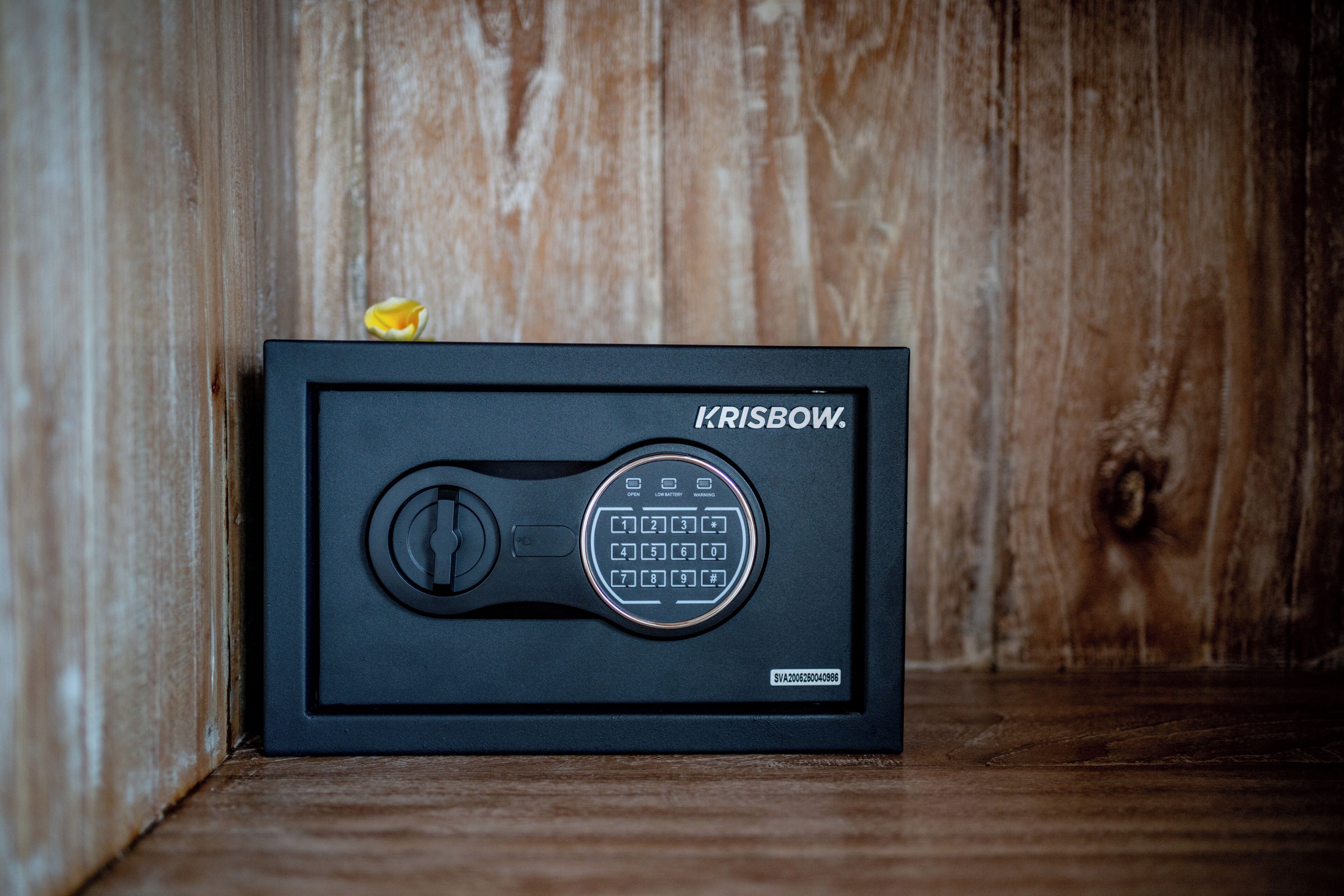 A black electronic device with a keypad and a logo labeled "KRISBOW."