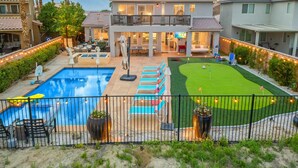 A residential property with a swimming pool, a tennis court, and a well-maintained lawn. - Golf, Lake & Mountain Views, Pool, Spa, BBQ, Games (Indio)