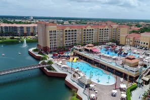 A hotel with a large pool, a water park, and a bridge over a body of water. - NEW YEAR WEEK!!! Westgate Vacation Villas in Orlando, FL ~2BRL/Sleeps 10 ~ 7Nts. (Kissimmee)