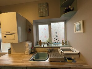 Oven, electric kettle, cookware/dishes/utensils, dining tables
