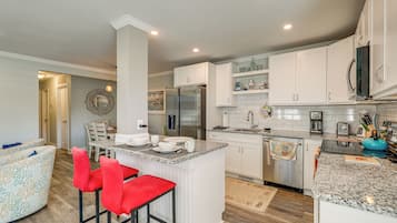 Fridge, stovetop, dishwasher, coffee/tea maker