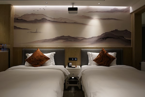 A hotel room with two beds, a nightstand, a wall-mounted projector, and a ceiling mural. - Paco Hotel Botanical Garden Metro (Guangzhou)
