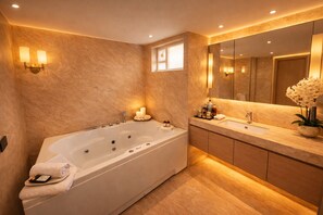 Hydromassage showerhead, designer toiletries, hair dryer, slippers