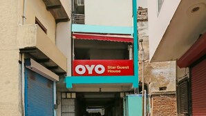 A building with a sign for 'OYO Star Guest House' indicating a guest accommodation. - Super Hotel O The Star Guest House (Rewari)