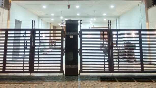 A building with a sign reading "Babylon Elegance" and a gated entrance. - Hotel Babylon Elegance (Mathura)