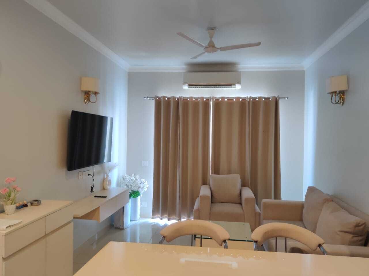 Luxury Apartment | Living area | 32-inch flat-screen TV with cable channels