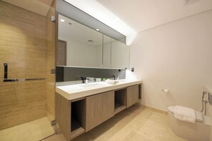 A modern bathroom with a large mirror, two sinks, a toilet, and a shower. - 1 BR Burj Khalifa View Sterling East (Dubai)
