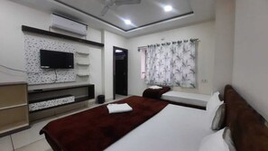 Deluxe Quadruple Room | Premium bedding, desk, laptop workspace, soundproofing - Hotel S M INN near Temple & Main Places (Ujjain)