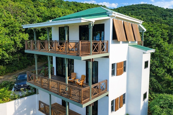 A boutique villa with ocean views nestled in the private estate of Green Bank.