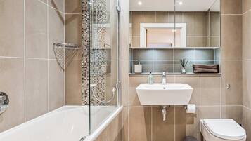 Shower, hair dryer, towels, shampoo
