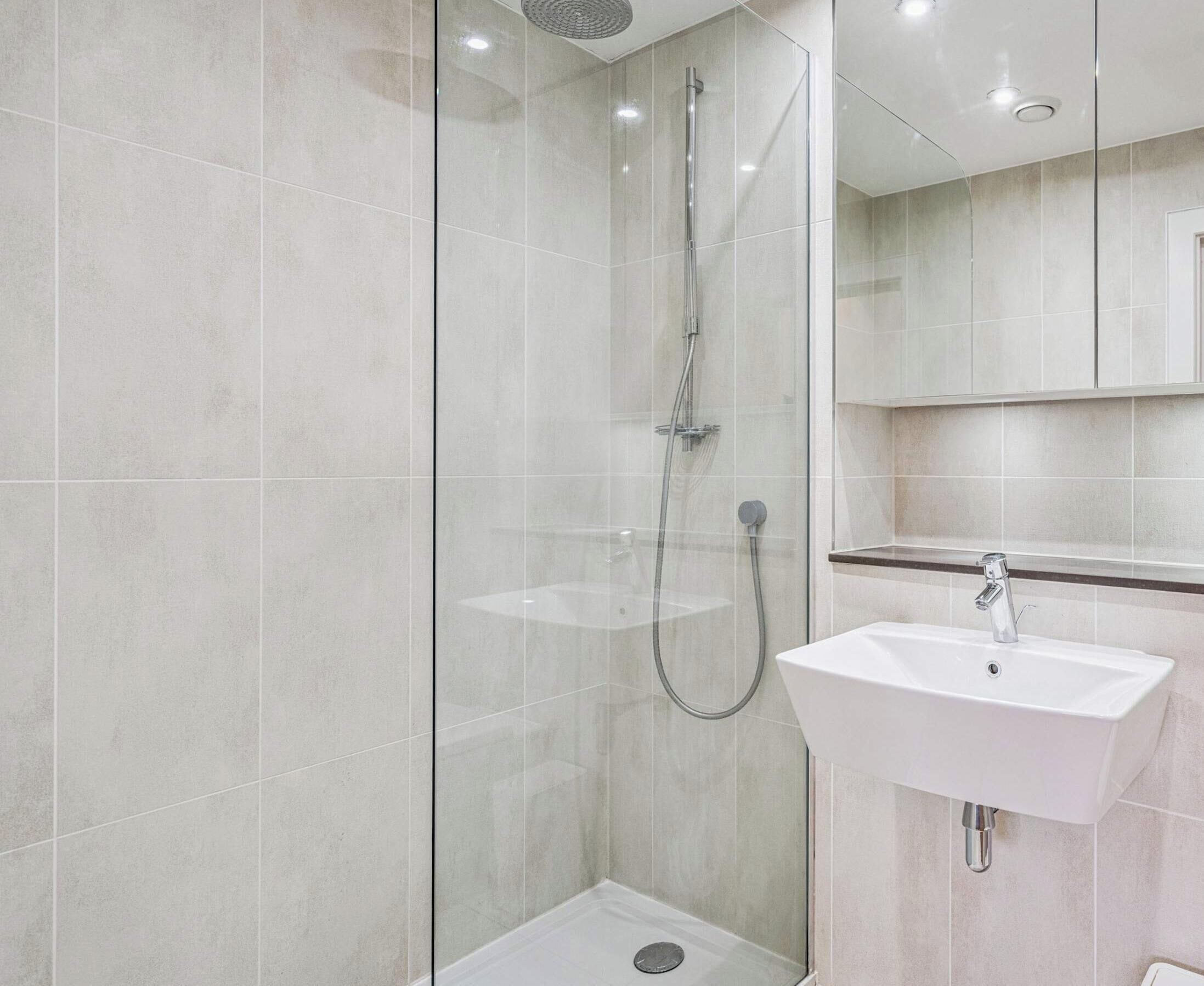 Shower, hair dryer, towels, shampoo