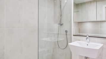 Shower, hair dryer, towels, shampoo