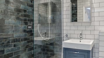 Shower, hair dryer, towels, shampoo