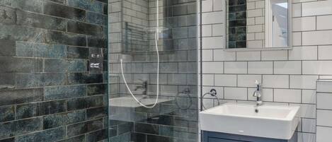 Shower, hair dryer, towels, shampoo