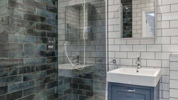 Shower, hair dryer, towels, shampoo