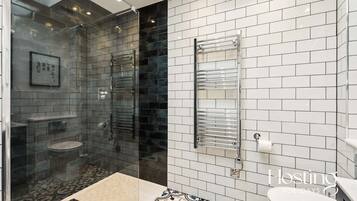 Shower, hair dryer, towels, shampoo