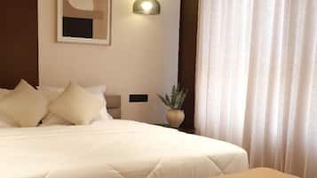 Deluxe Room, Garden View | Desk, laptop workspace, iron/ironing board, free WiFi