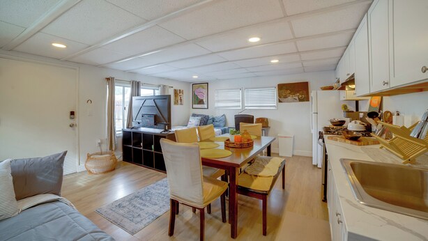 A compact living space with a dining area, kitchenette, and a sofa. - 5 Mi to Dtwn Riverside & Hospital! Remote-work Hub (Riverside)