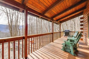 A wooden deck with a view of a forest and mountains. - Family Log Cabin w/ Mtn Views, 2 Mi to Tube World! (Maggie Valley)