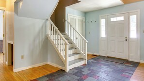 A staircase with white railings leading to a landing. - Hiking & Skiing Galore! Home in East Wallingford (East Wallingford)