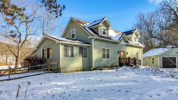 A two-story house with a front porch and a garage. - Hiking & Skiing Galore! Home in East Wallingford (East Wallingford)