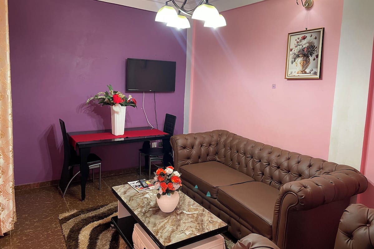 Premium Apartment, 2 Bedrooms, Balcony, Courtyard View | Living area | 24-inch flat-screen TV with cable channels, pay movies