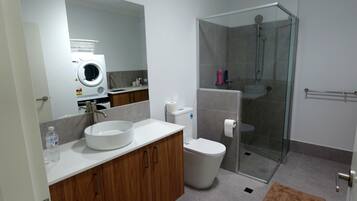 Shower, towels, soap, toilet paper